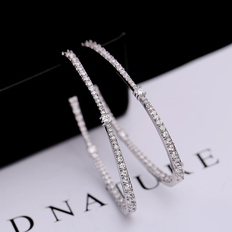2025 Korean personality fashion tassel exaggerated micro-inlaid zircon 925 silver needle hoop earrings female geometric oval earrings