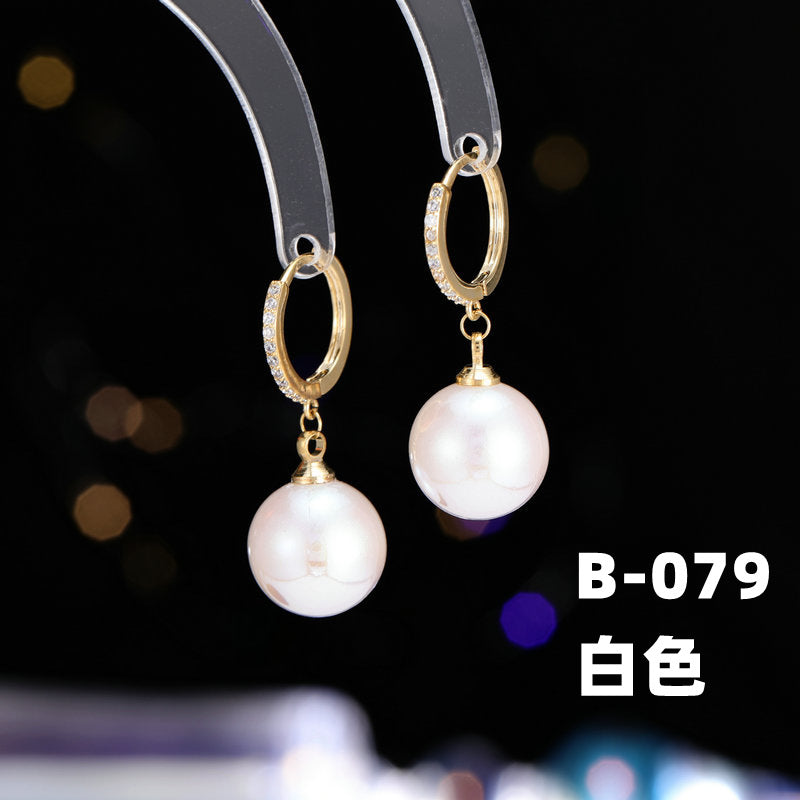 2025 Earrings suitable for Chinese New Year wear, simple and versatile, trendy temperament, red pearl niche design, autumn and winter earrings wholesale