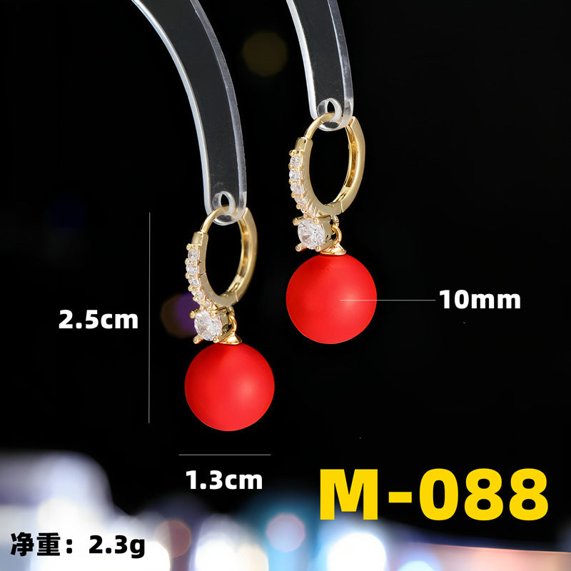 2025 Earrings suitable for Chinese New Year wear, simple and versatile, trendy temperament, red pearl niche design, autumn and winter earrings wholesale