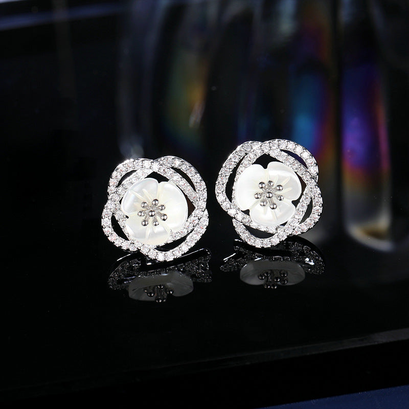 2025 Stylish hollow camellia simple temperament natural shell flower earrings s925 silver needle niche design earrings