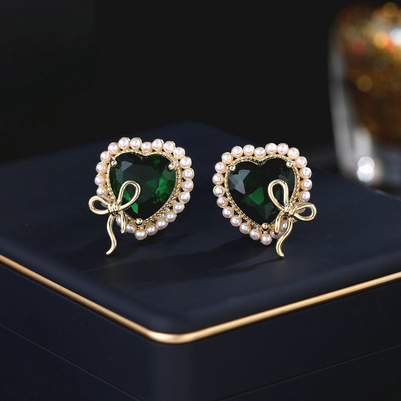 2025 Designer super flash heart-shaped zircon inlaid earrings niche pro-luxury high-end pearl bow love stud earrings