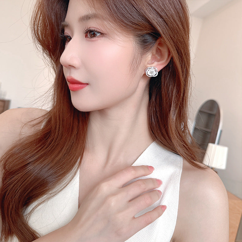 2025 Stylish hollow camellia simple temperament natural shell flower earrings s925 silver needle niche design earrings