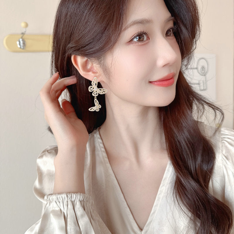2025 Niche high-end micro-inlaid zirconium hollow butterfly earrings s925 silver needle design exquisite versatile temperament earrings