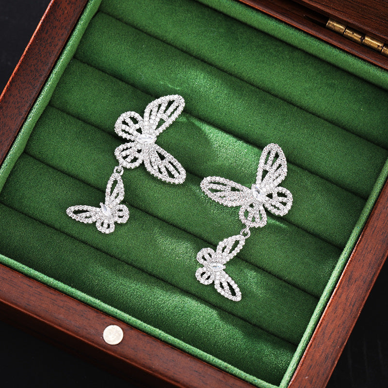 2025 Niche high-end micro-inlaid zirconium hollow butterfly earrings s925 silver needle design exquisite versatile temperament earrings