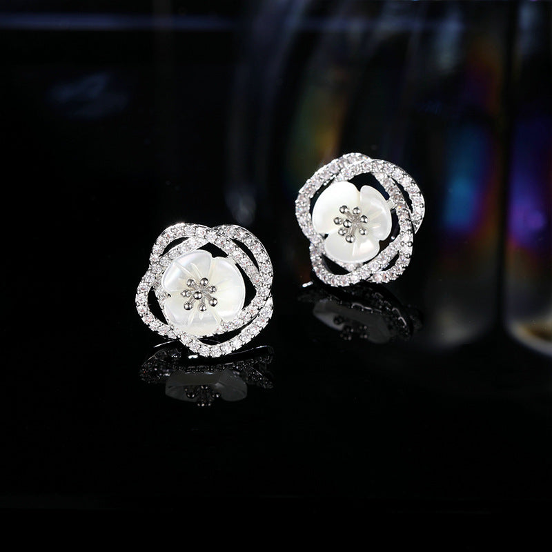 2025 Stylish hollow camellia simple temperament natural shell flower earrings s925 silver needle niche design earrings
