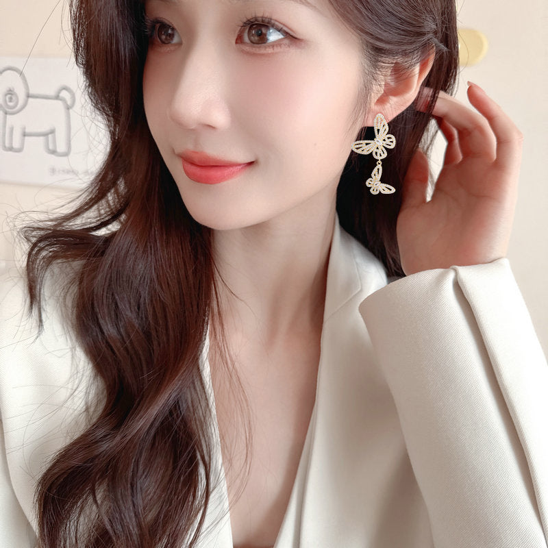 2025 Niche high-end micro-inlaid zirconium hollow butterfly earrings s925 silver needle design exquisite versatile temperament earrings