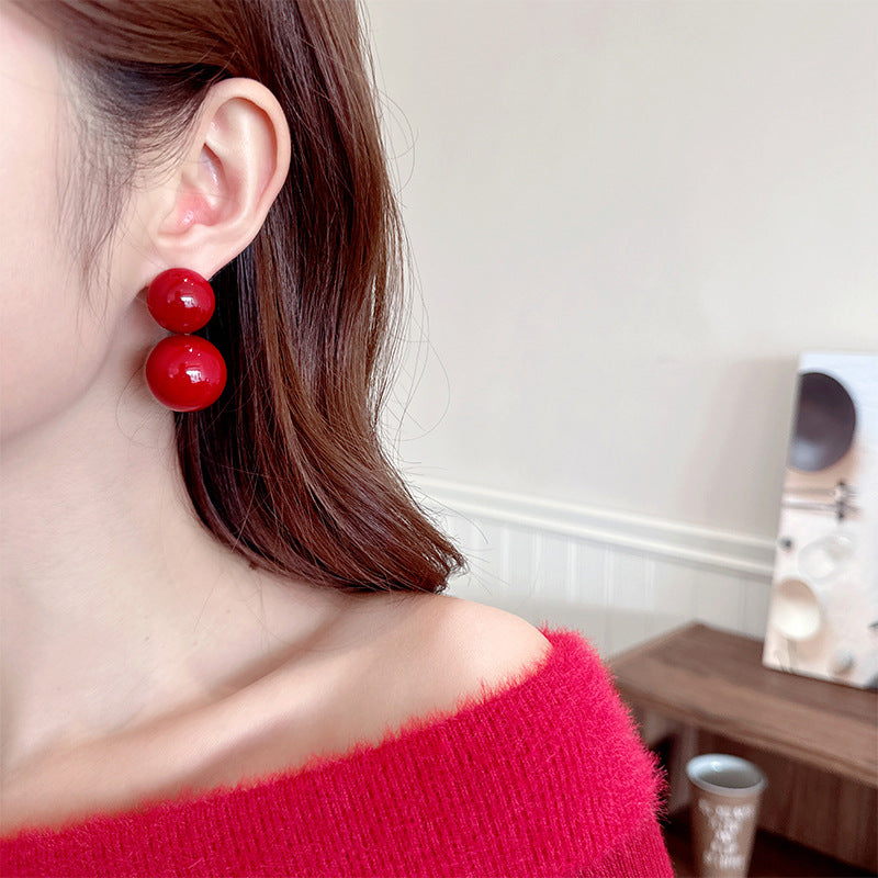 2025 New Year's autumn and winter exaggerated earrings high-end sense light luxury retro temperament earrings Ankola red round pearl stud earrings