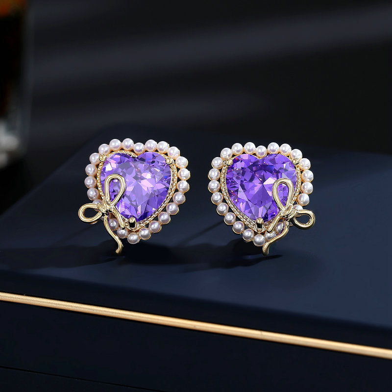 2025 Designer super flash heart-shaped zircon inlaid earrings niche pro-luxury high-end pearl bow love stud earrings