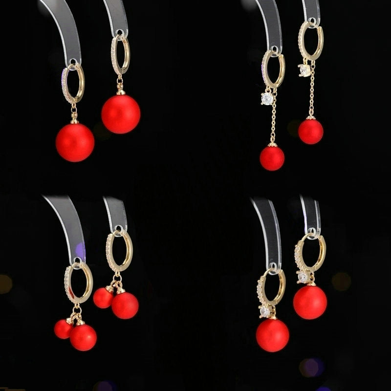 2025 Earrings suitable for Chinese New Year wear, simple and versatile, trendy temperament, red pearl niche design, autumn and winter earrings wholesale
