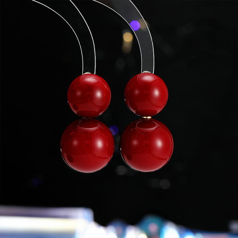 2025 New Year's autumn and winter exaggerated earrings high-end sense light luxury retro temperament earrings Ankola red round pearl stud earrings