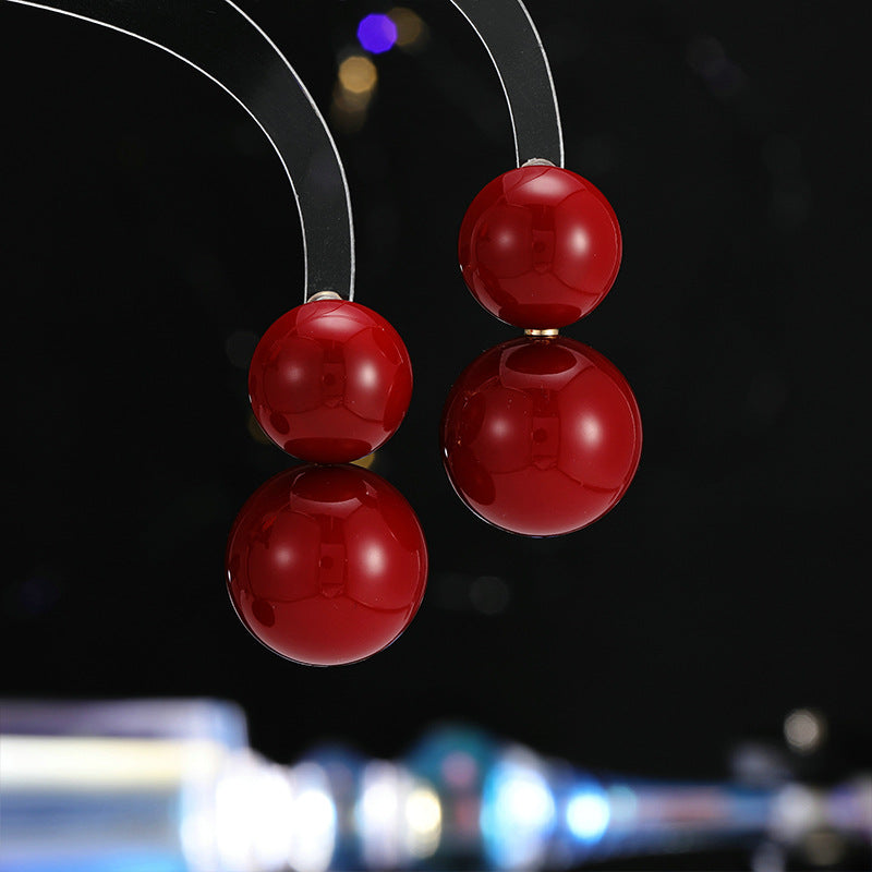 2025 New Year's autumn and winter exaggerated earrings high-end sense light luxury retro temperament earrings Ankola red round pearl stud earrings