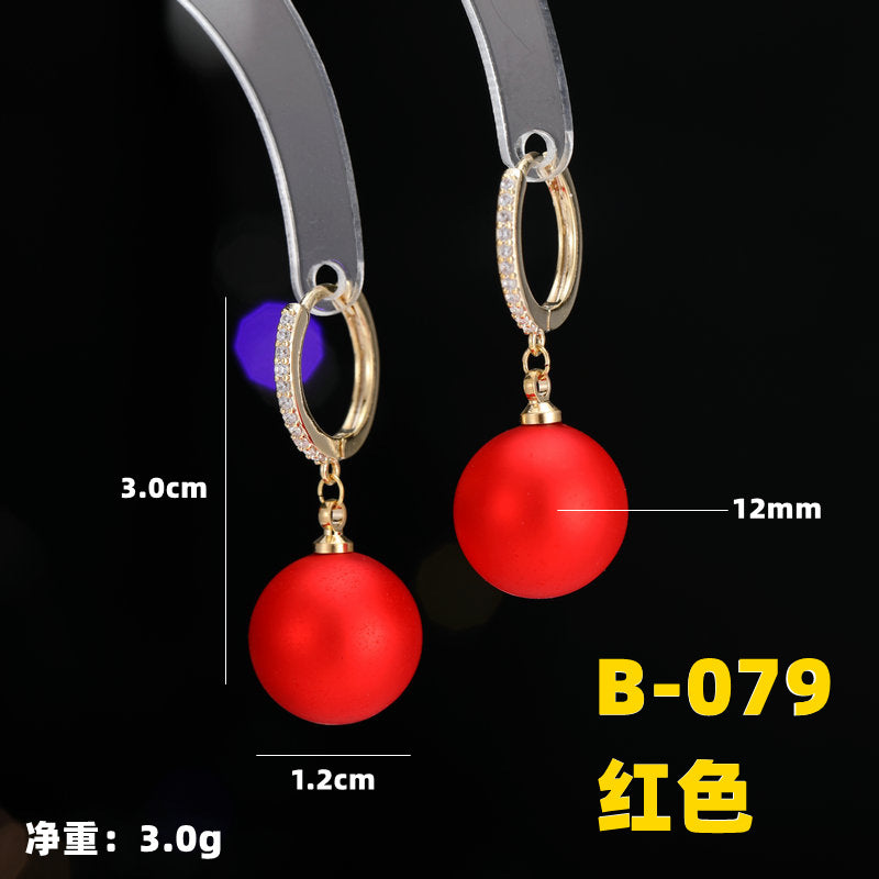 2025 Earrings suitable for Chinese New Year wear, simple and versatile, trendy temperament, red pearl niche design, autumn and winter earrings wholesale