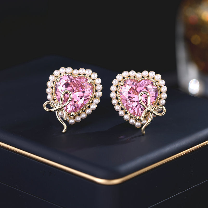 2025 Designer super flash heart-shaped zircon inlaid earrings niche pro-luxury high-end pearl bow love stud earrings