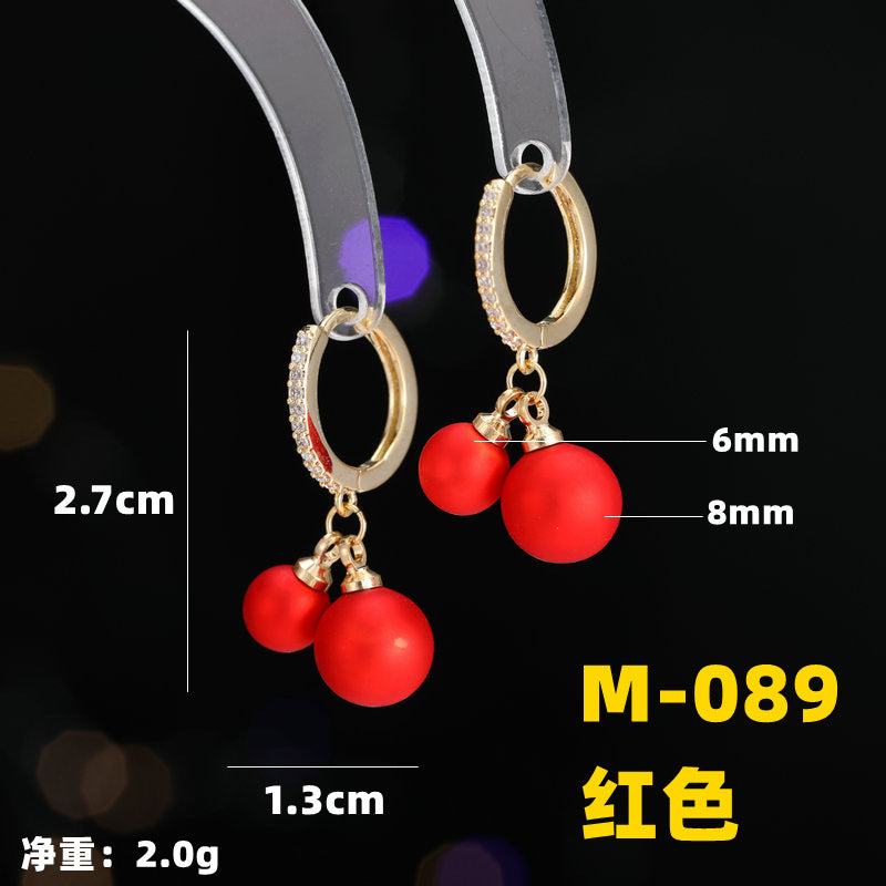 2025 Earrings suitable for Chinese New Year wear, simple and versatile, trendy temperament, red pearl niche design, autumn and winter earrings wholesale