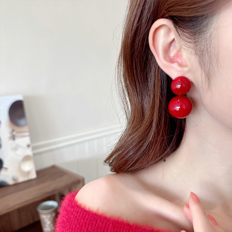 2025 New Year's autumn and winter exaggerated earrings high-end sense light luxury retro temperament earrings Ankola red round pearl stud earrings
