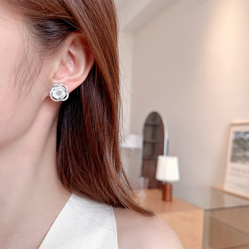 2025 Stylish hollow camellia simple temperament natural shell flower earrings s925 silver needle niche design earrings