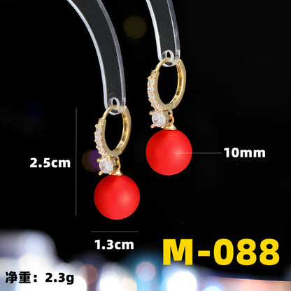 2025 Earrings suitable for Chinese New Year wear, simple and versatile, trendy temperament, red pearl niche design, autumn and winter earrings wholesale