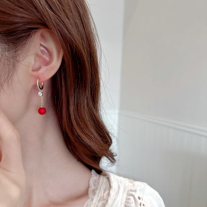 2025 Earrings suitable for Chinese New Year wear, simple and versatile, trendy temperament, red pearl niche design, autumn and winter earrings wholesale