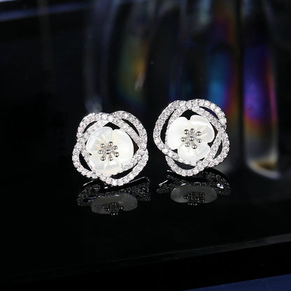 2025 Stylish hollow camellia simple temperament natural shell flower earrings s925 silver needle niche design earrings