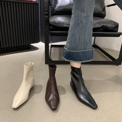 2025 Fried soft slope heel~ popular autumn and winter new white bone essence commuter flat-bottomed beige short boots simple
