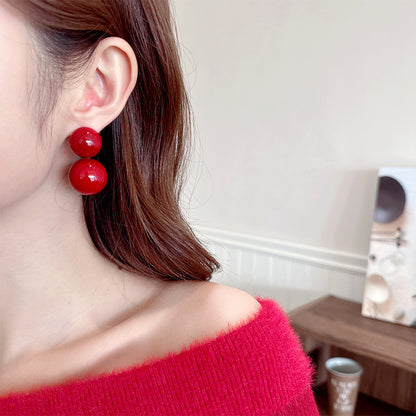 2025 New Year's autumn and winter exaggerated earrings high-end sense light luxury retro temperament earrings Ankola red round pearl stud earrings