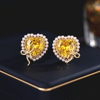 2025 Designer super flash heart-shaped zircon inlaid earrings niche pro-luxury high-end pearl bow love stud earrings