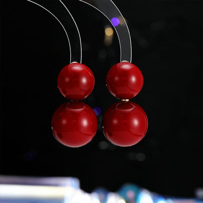 2025 New Year's autumn and winter exaggerated earrings high-end sense light luxury retro temperament earrings Ankola red round pearl stud earrings