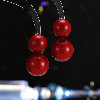 2025 New Year's autumn and winter exaggerated earrings high-end sense light luxury retro temperament earrings Ankola red round pearl stud earrings
