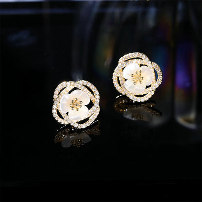 2025 Stylish hollow camellia simple temperament natural shell flower earrings s925 silver needle niche design earrings