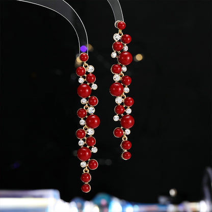 2025 Chinese retro red New Year's earrings, long temperament showing face, thin studs,  exaggerated simple and versatile pearl earrings.