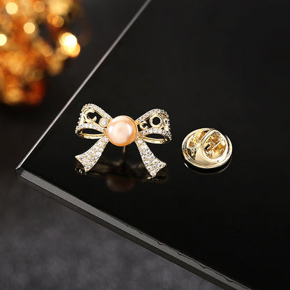 2025 Japan and South Korea spring and summer clothing temperament freshwater pearl zircon anti-light buckle pin cardigan collar pin butterfly section spike needle